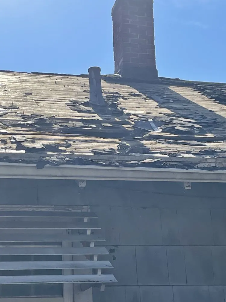 Slide of Kingpin Roofing