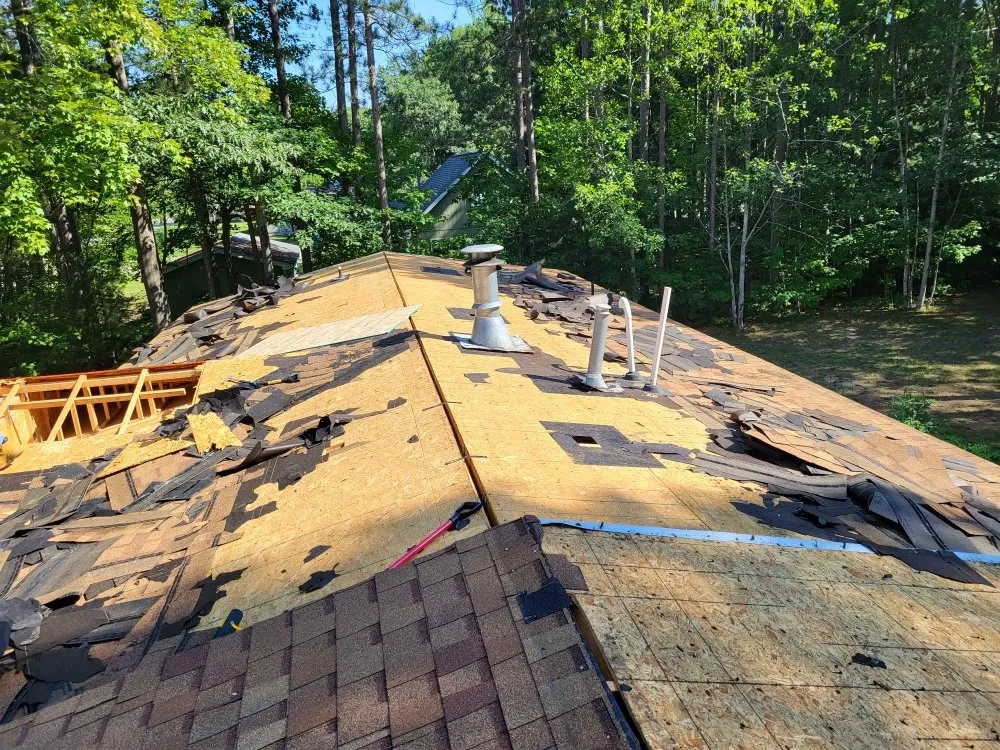 Local residential roofing service after storm damage in Mancelona, MI by Kings Roofing And Plowing