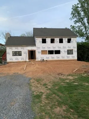 K&M Roofing and Contracting Logo