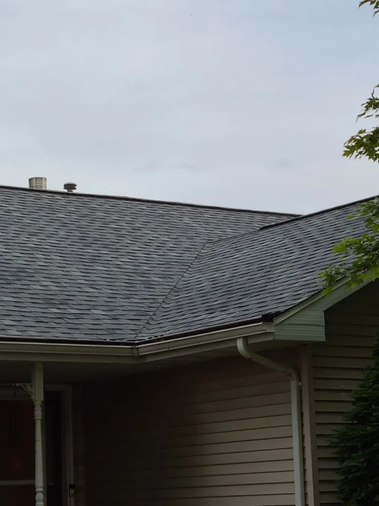 Slide of KMJ Roof Masters