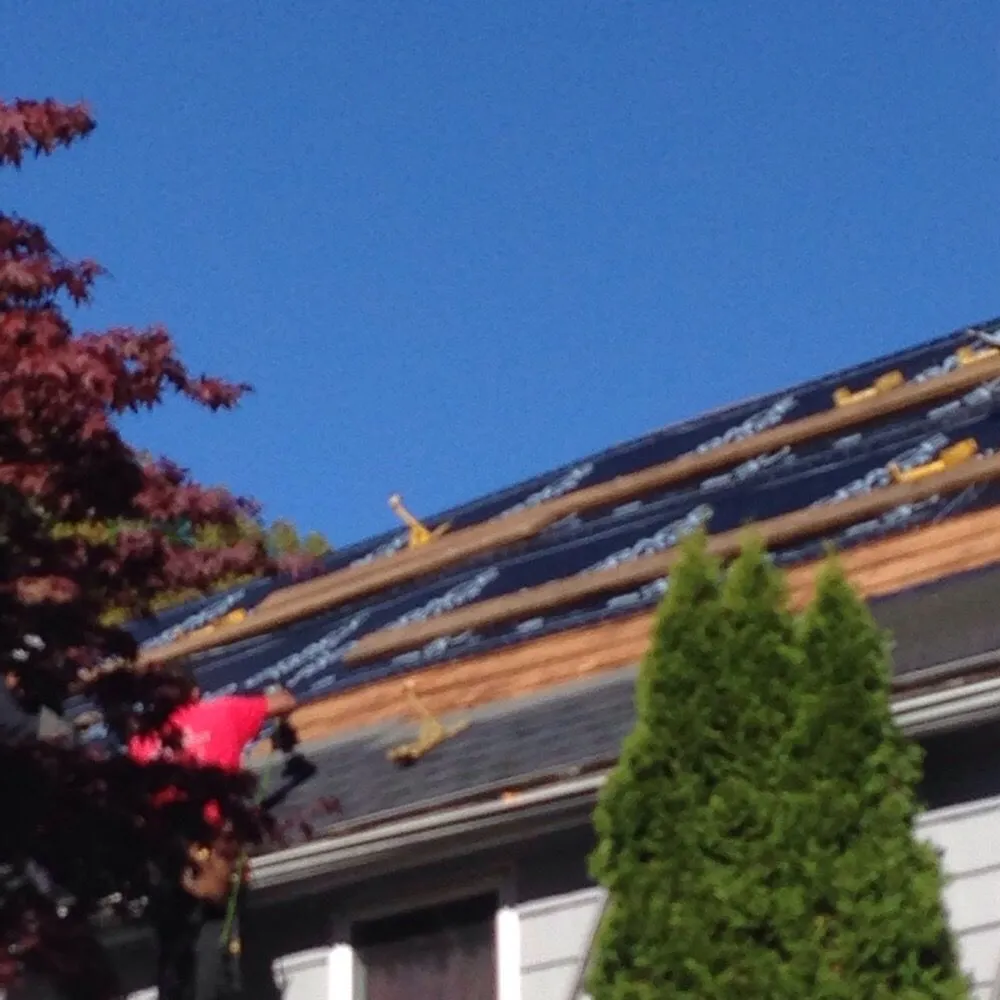 Slide of KMK Roofing