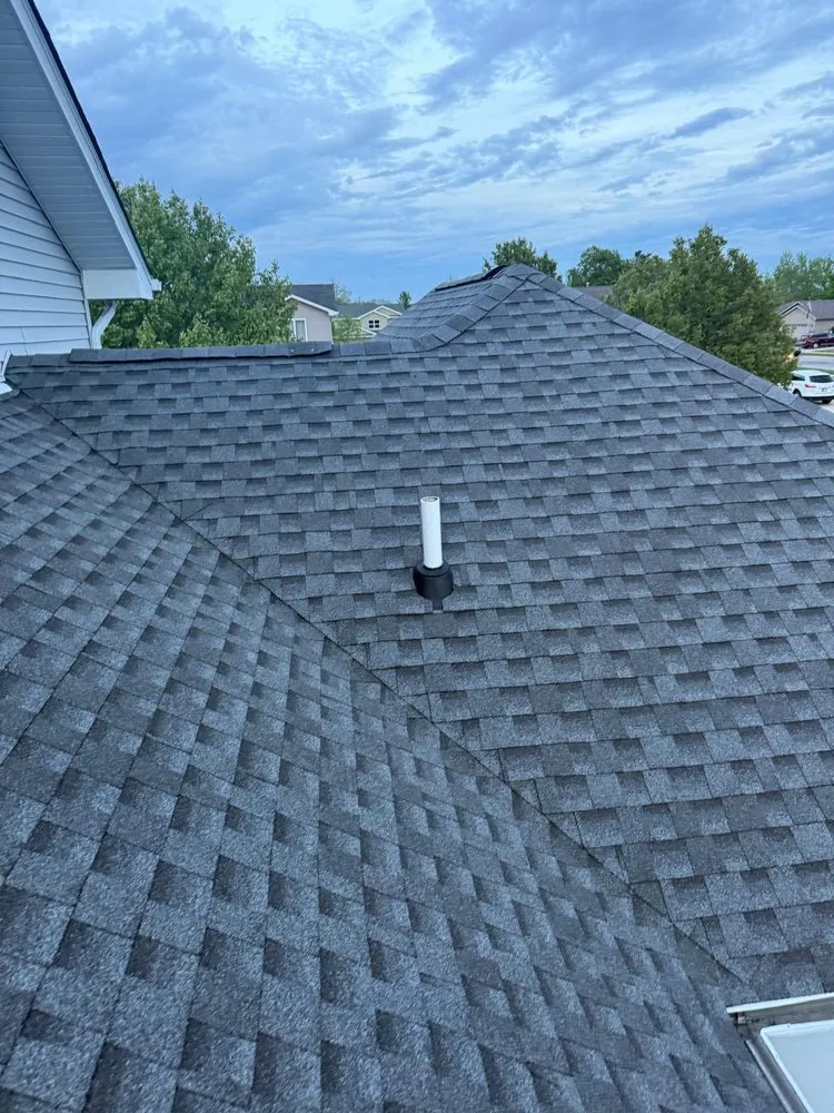 Slide of Koster Roofing