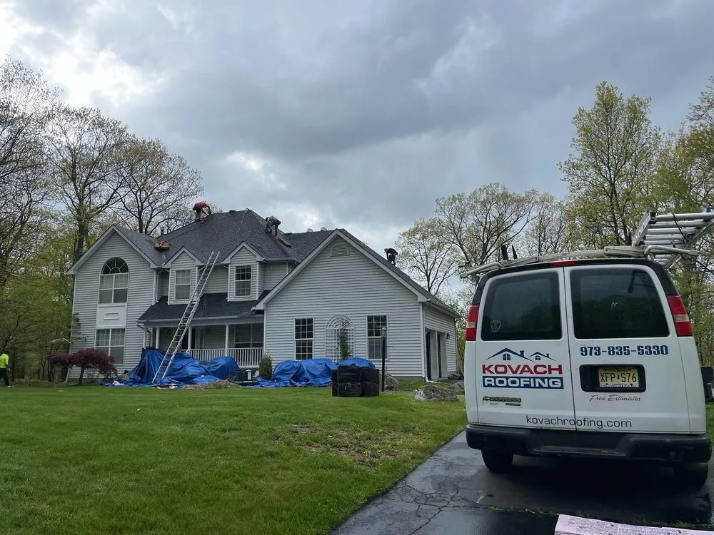 Professional roof repair after storm damage in Pequannock Township, NJ by Kovach Roofing