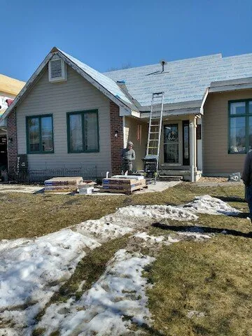 Professional storm damage roof repair with free inspection in Baxter, IA by Kunkel Construction