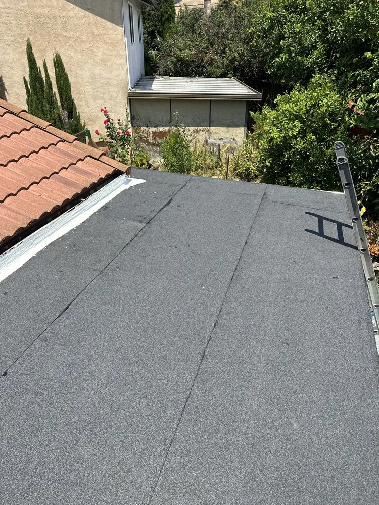 Slide of LAAC Roofing Services