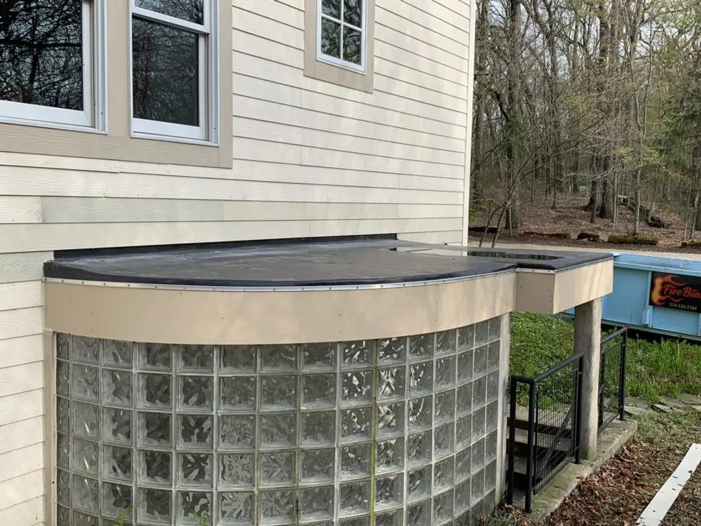 Expert storm damage roof repair for fast service in Lawrence, MI by Lakeside Renovations