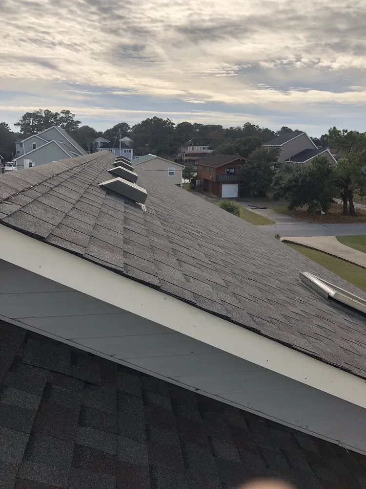 Slide of LAM Construction and Roofing