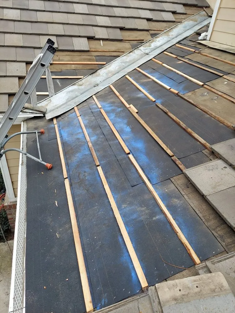 Slide of Landeros Roofing Solutions