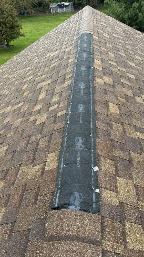 Slide of Layman Roofing & Siding