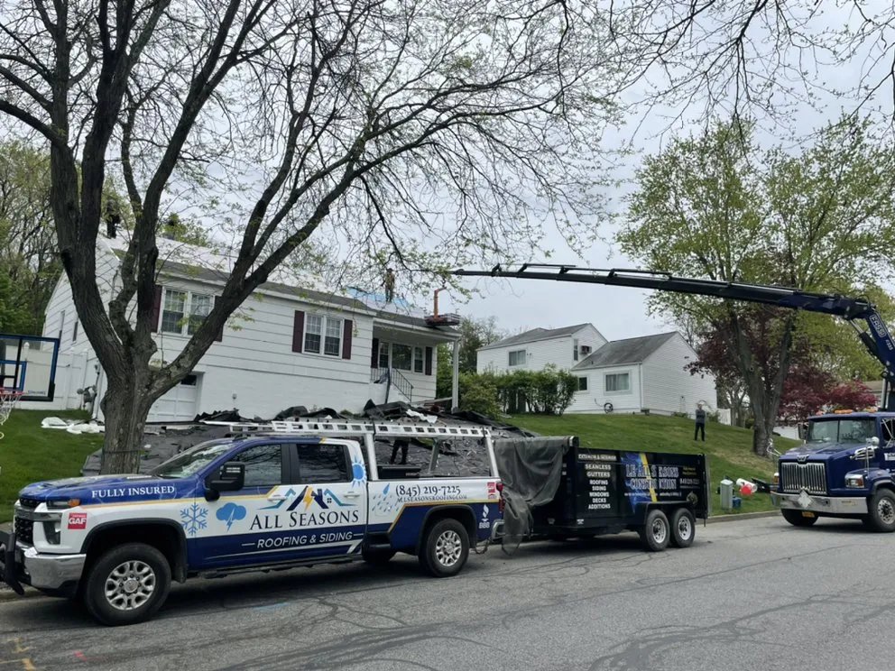 Slide of LE All Season Roofing & Siding