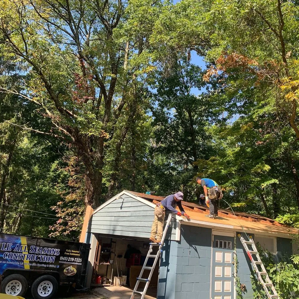 Slide of LE All Season Roofing & Siding