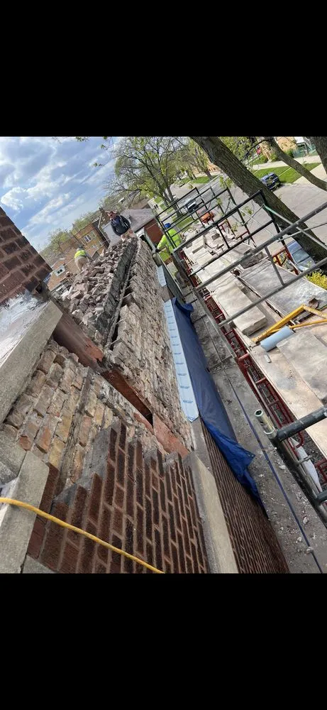 Slide of Leo's Roofing & Masonry