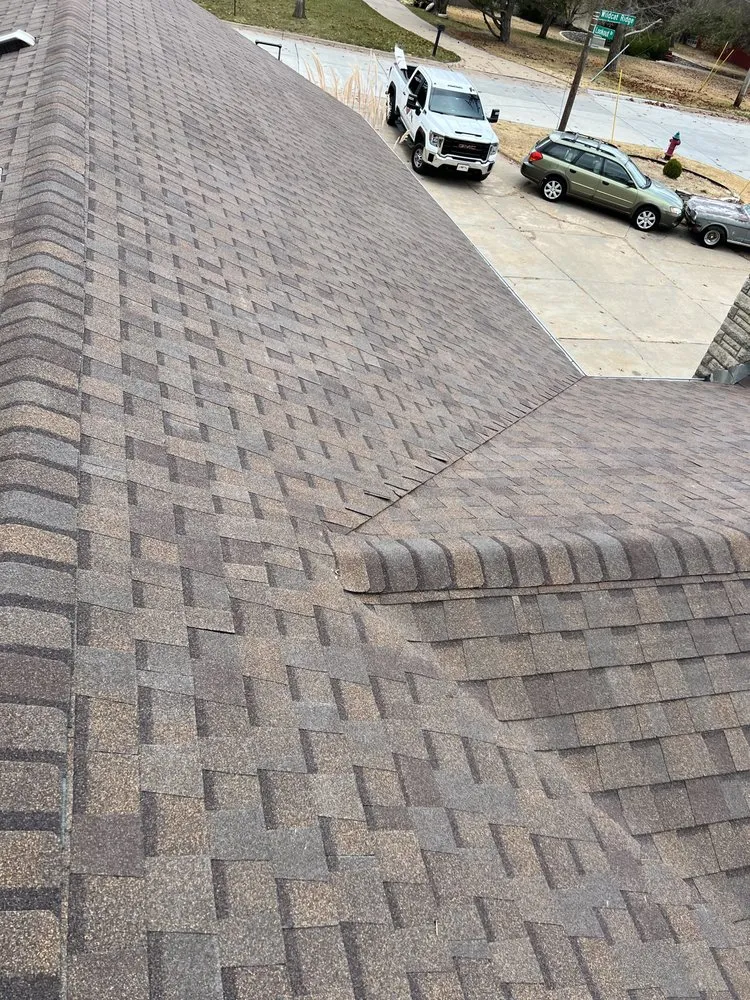 Slide of Little Apple Roofing