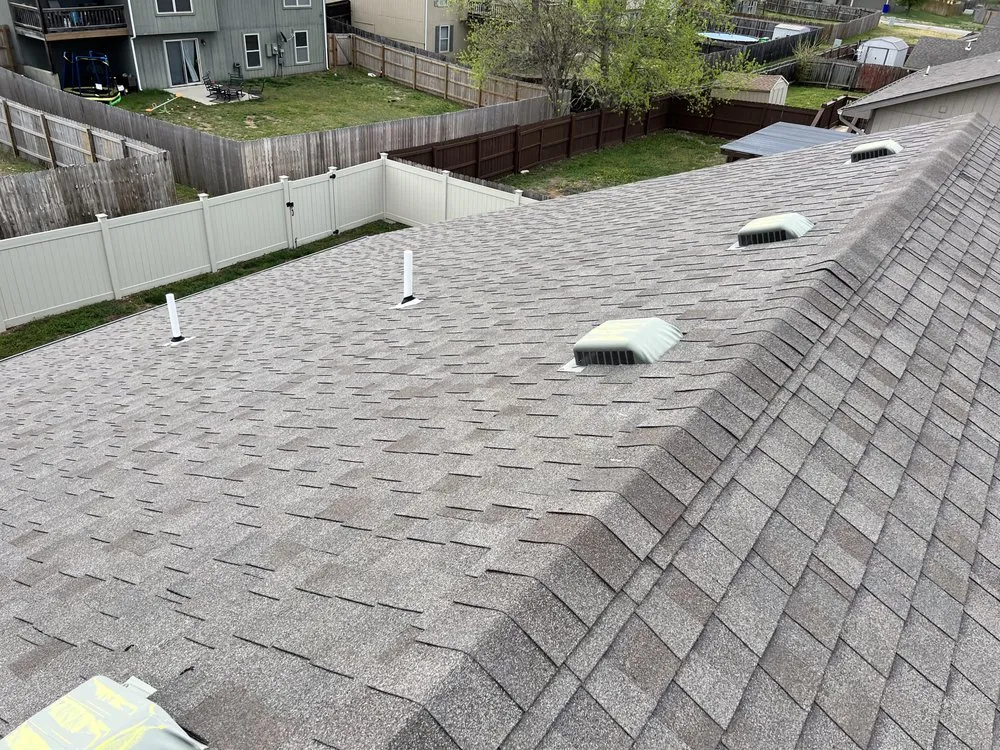 Slide of Little Apple Roofing