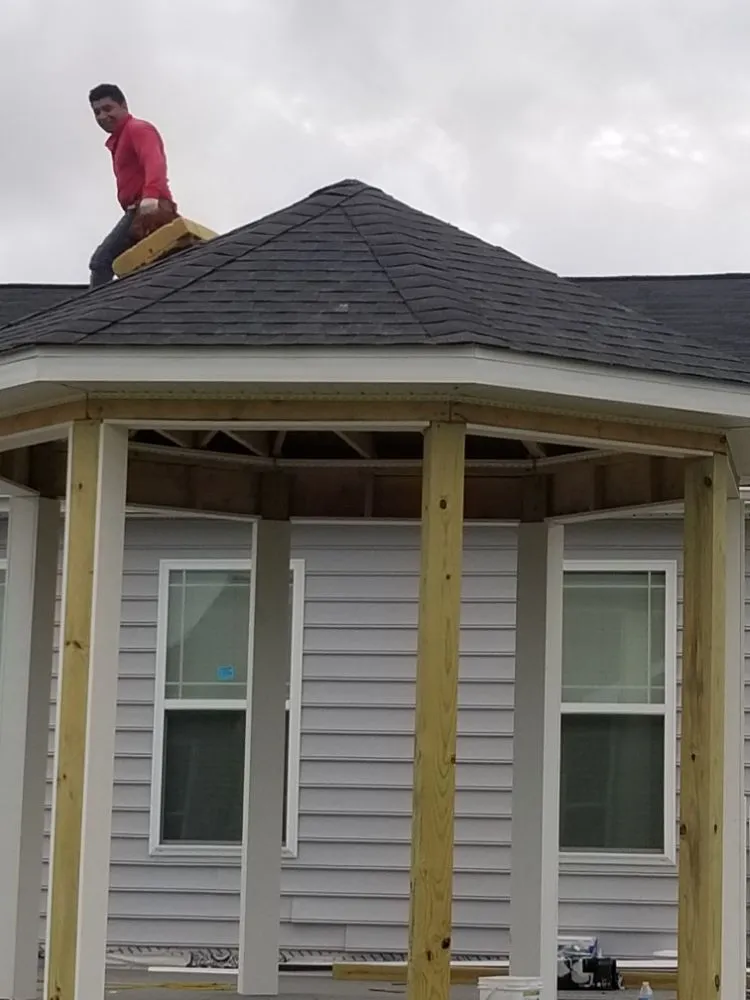 Slide of Little Tiger Roofing