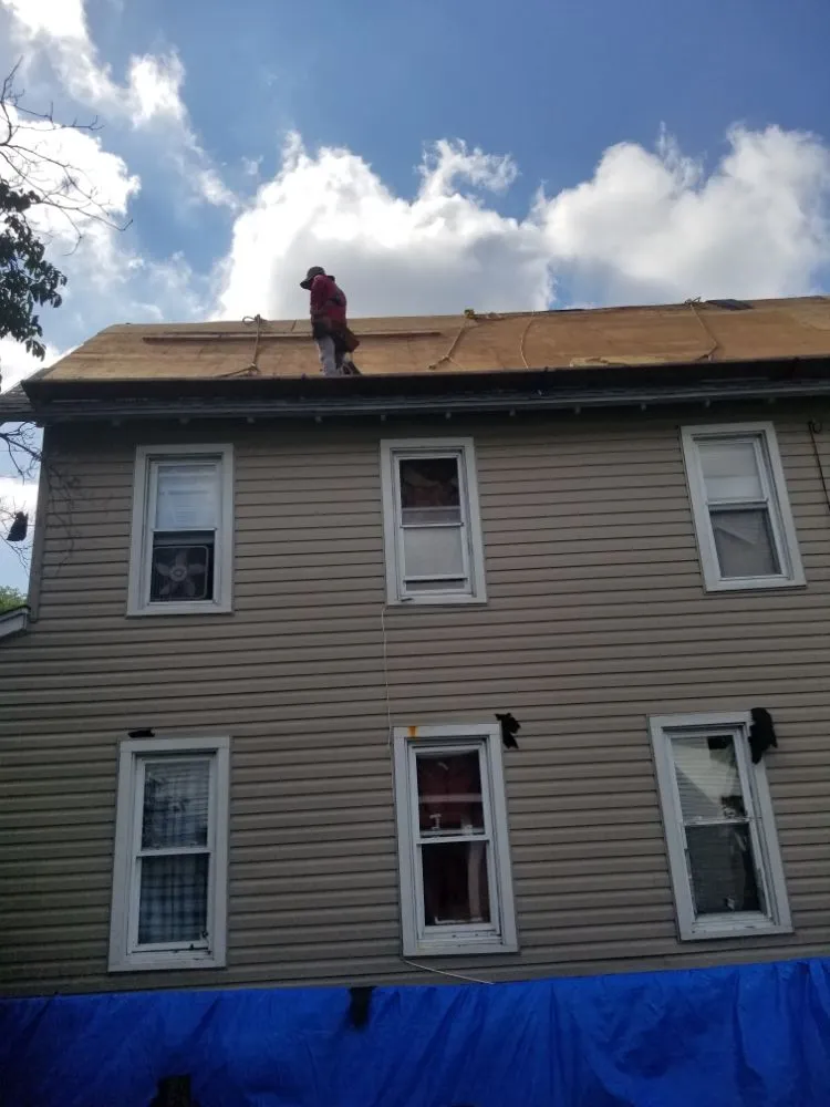 Slide of Little Tiger Roofing