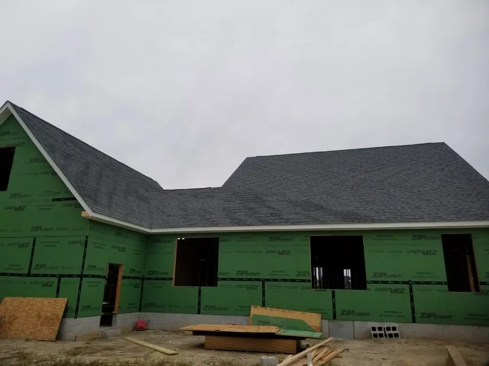 Slide of Little Tiger Roofing