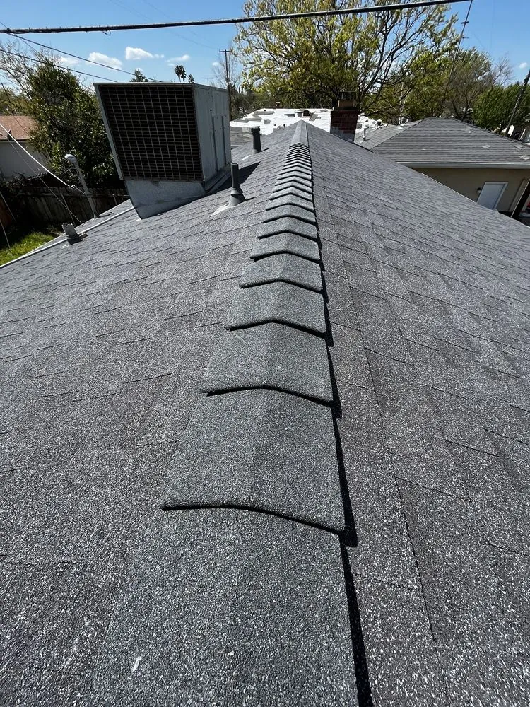 Slide of Los Reyes Roofing