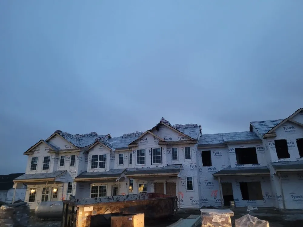 Slide of Los Tres Hermanos Roofing