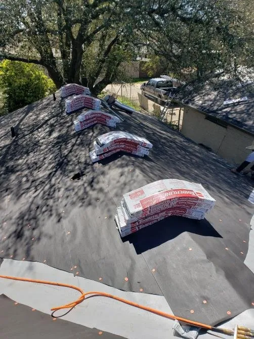 Slide of Luy's Roofing