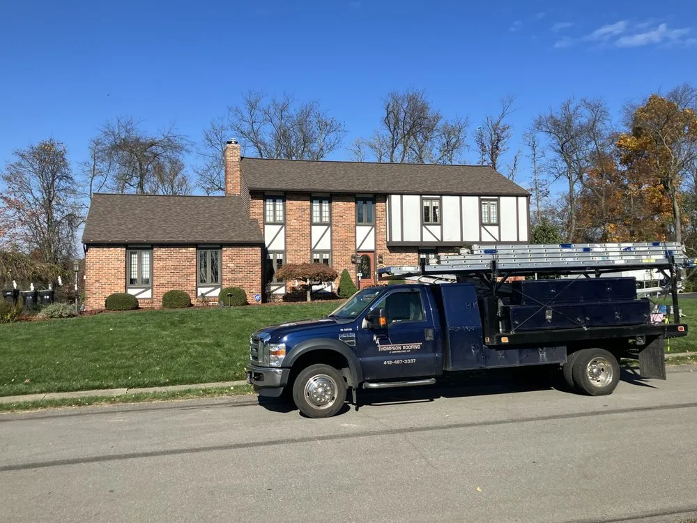 Slide of MA Thompson Roofing