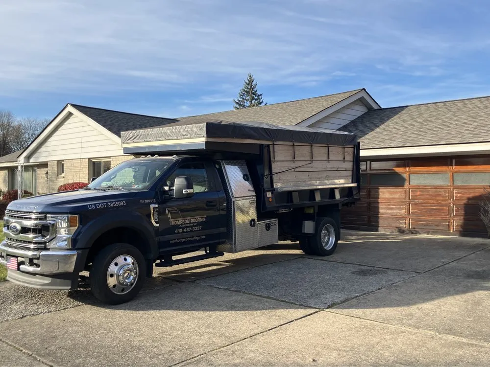 Slide of MA Thompson Roofing