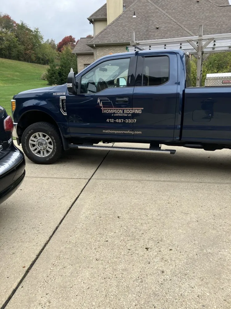 Slide of MA Thompson Roofing