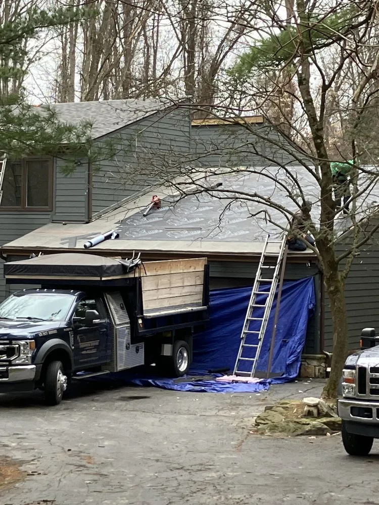 Slide of MA Thompson Roofing