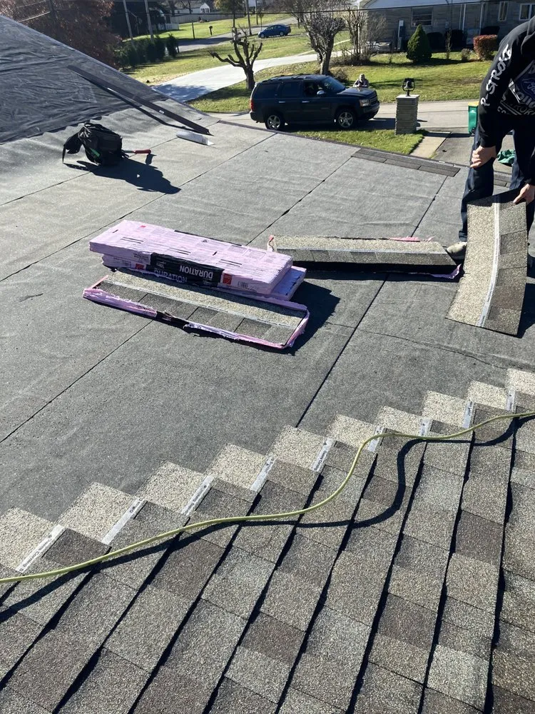 Slide of MA Thompson Roofing