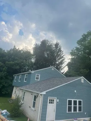 Machuca Roofing and Gutters Logo