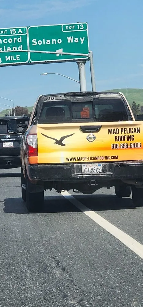 Slide of Mad Pelican Roofing