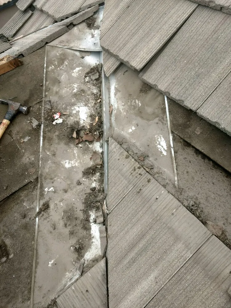 Slide of Magic Hands Roofing