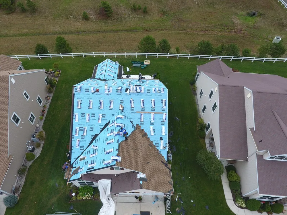 Trusted storm damage roof repair near you in Ewing Township, NJ by Magic Roofing & Siding