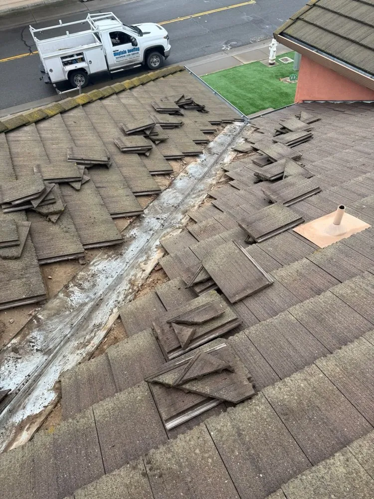 Slide of Maginis Roofing