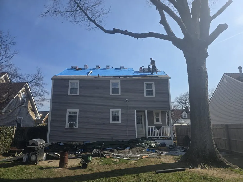 Slide of Malanda Exteriors | Roofing and Siding Company