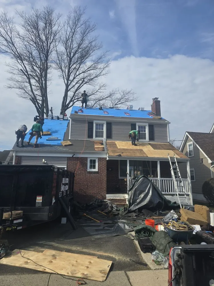 Slide of Malanda Exteriors | Roofing and Siding Company