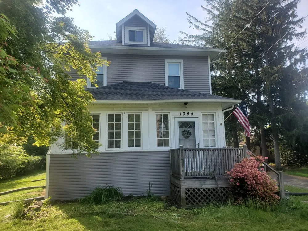 Slide of Malanda Exteriors | Roofing and Siding Company