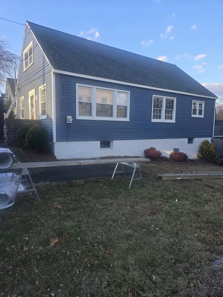 Slide of Malanda Exteriors | Roofing and Siding Company