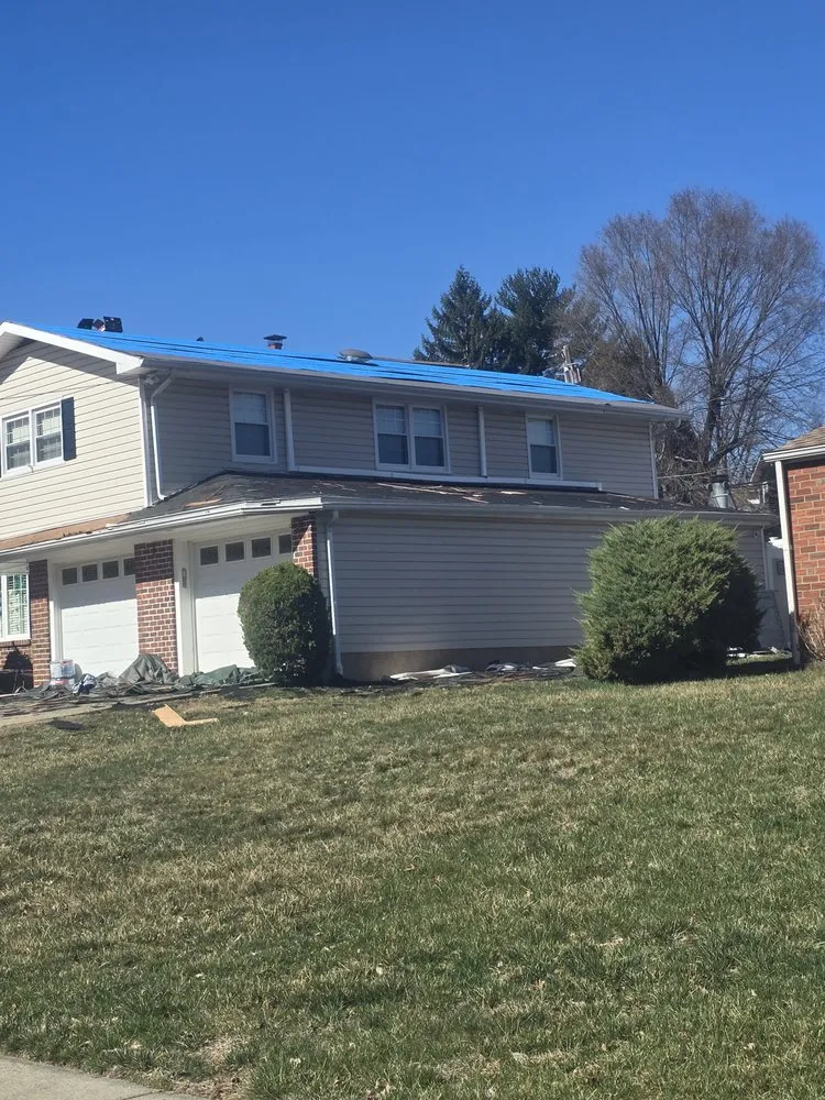 Slide of Malanda Exteriors | Roofing and Siding Company