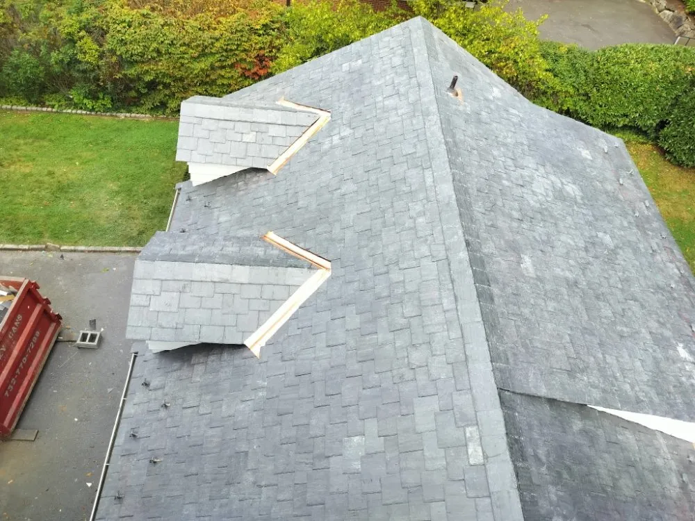 Slide of Malanda Exteriors | Roofing and Siding Company