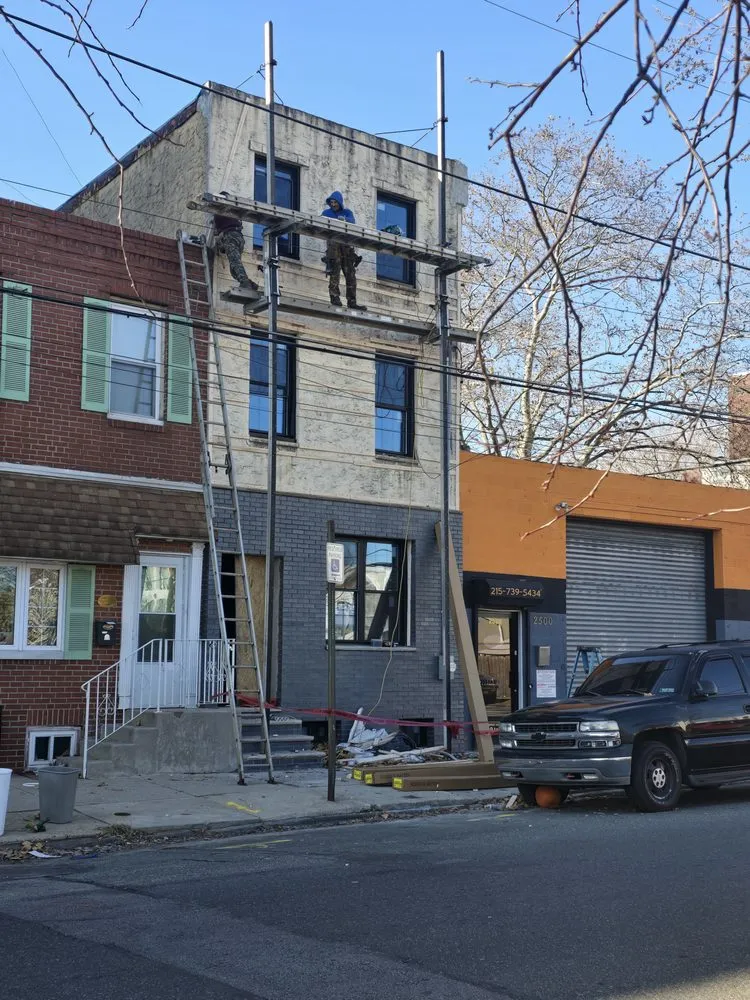 Slide of Malanda Exteriors | Roofing and Siding Company