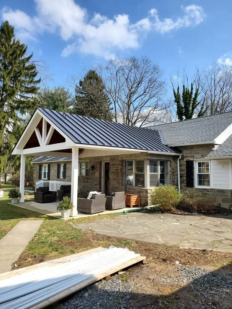 Slide of Malanda Exteriors | Roofing and Siding Company