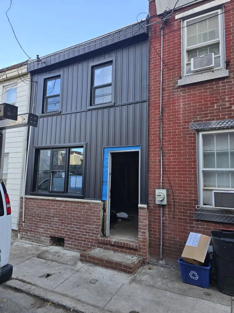 Slide of Malanda Exteriors | Roofing and Siding Company