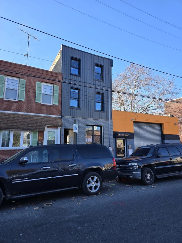 Slide of Malanda Exteriors | Roofing and Siding Company