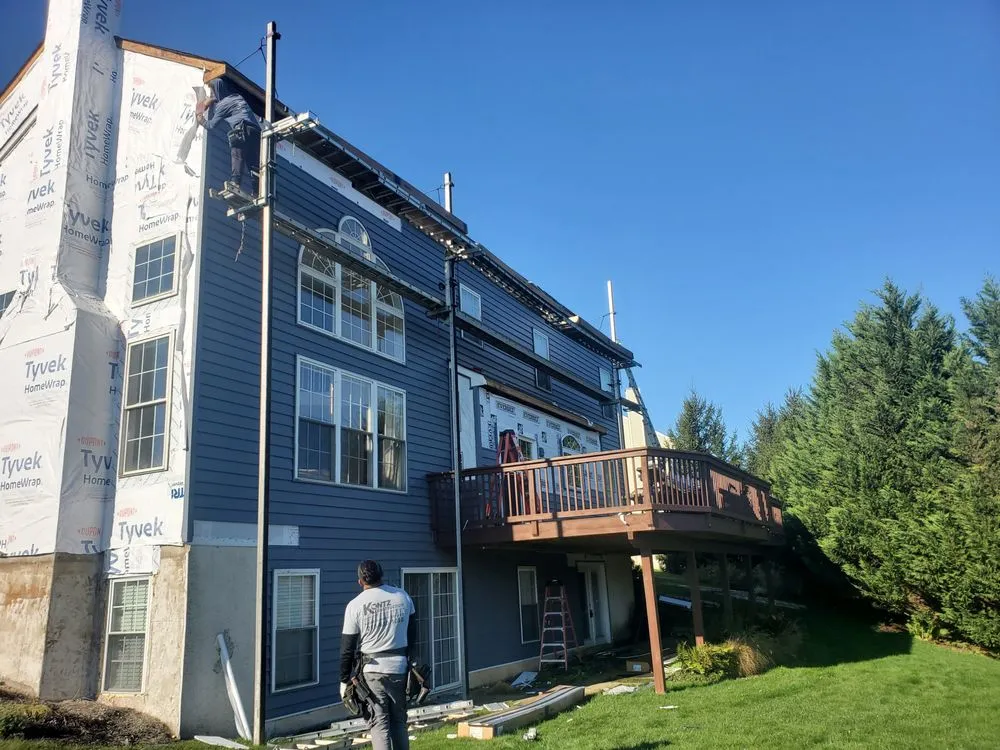 Slide of Malanda Exteriors | Roofing and Siding Company