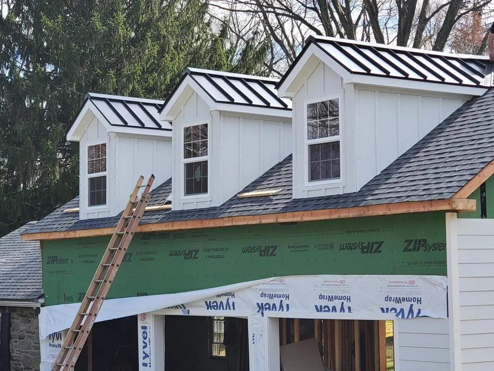 Slide of Malanda Exteriors | Roofing and Siding Company