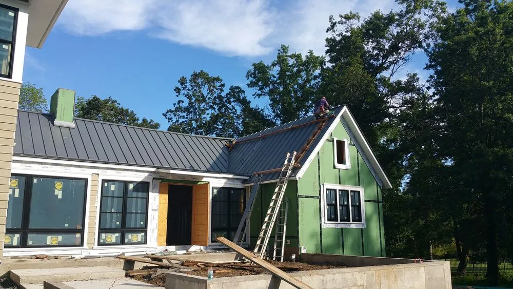 Slide of Malanda Exteriors | Roofing and Siding Company