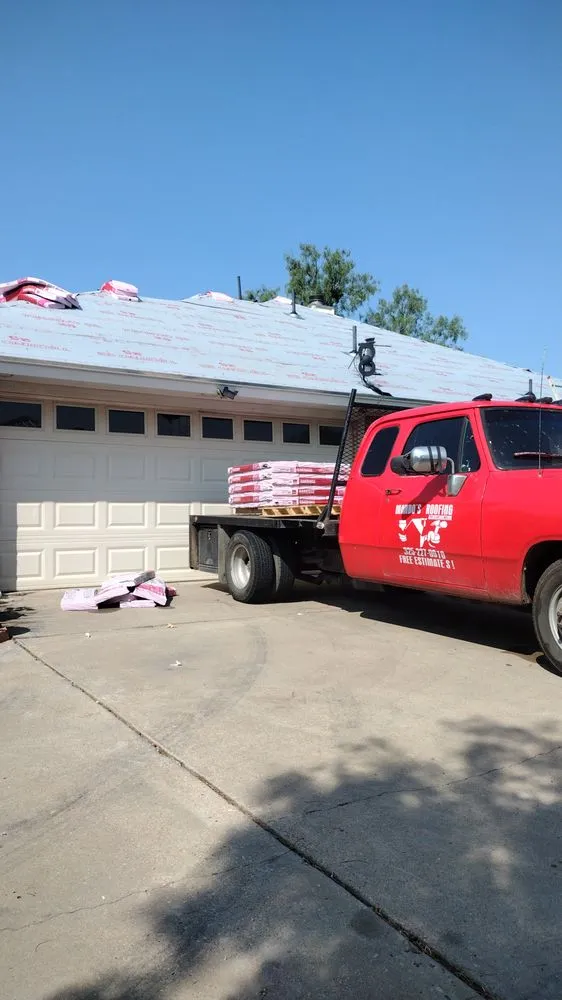 Slide of Mando’s Roofing & Construction
