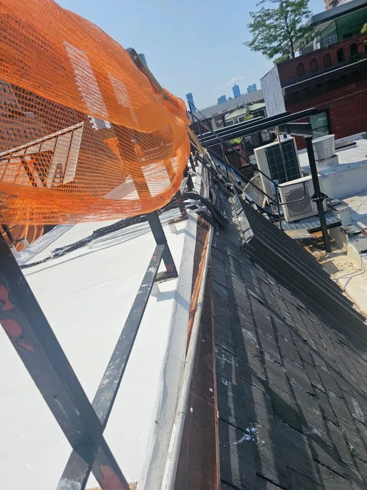 Slide of Manhattan Roofing