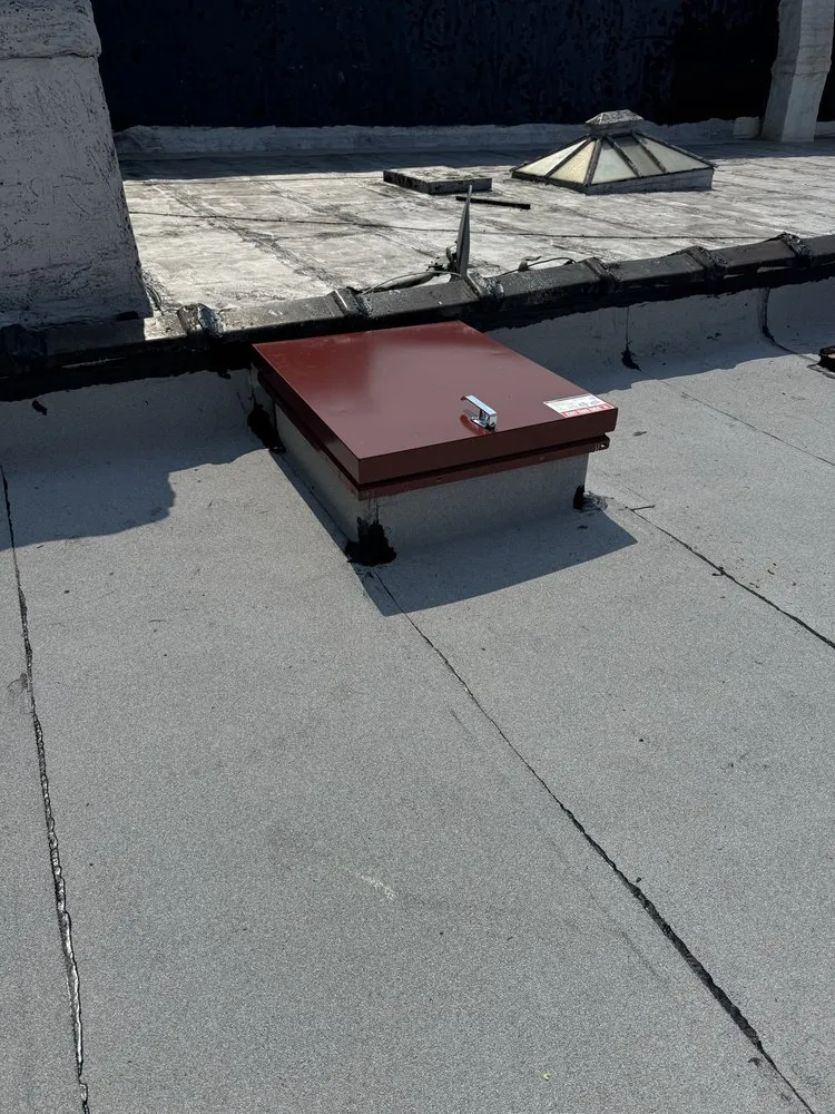 Slide of Manhattan Roofing